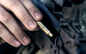 7.62x39 boresight installation demonstration showing proper rifle chamber insertion
